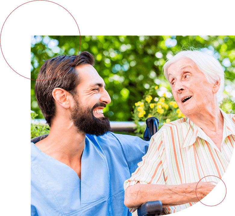 Nurse having chat with senior woman in nursing home